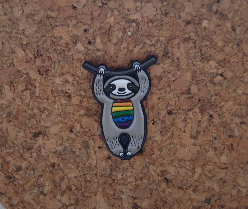 Spread Joy with Our Rainbow Sloth Hard Enamel Pin!